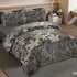 Gray floral patterned bedding set on a bed in a bedroom.