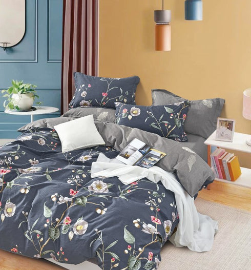 A single bedsheet with pillow covers featuring a floral pattern, displayed on a bed in a bedroom setting